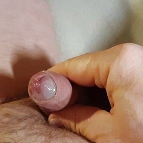 Slimy glans and foreskin play with the limp dick.