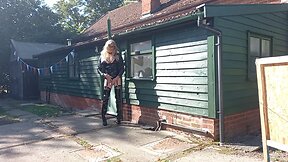 Transgender person in pvc outdoors