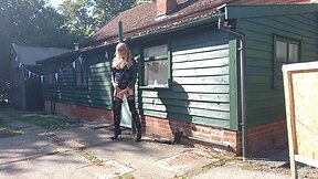 Transgender person in pvc outdoors