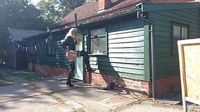 Transgender person in pvc outdoors