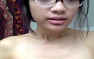 Japanese girl plays with her sex toy
