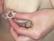 Hot MILF w/ pierced nipples demonstrates changing out the hoops for shields