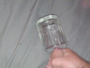 Solo masturbation cumshot into glass cup