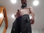 Chav lad jerks off a big cock in sweatpants and black sneakers