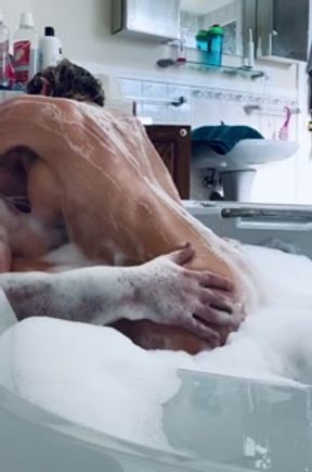 Dirty milf gets covered in bubbles and soaped up to fuck