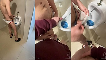 2 boys having fun at the pool public toilets' urinal