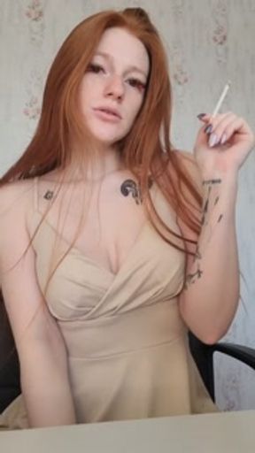 smoking redhead with colored eyelashes