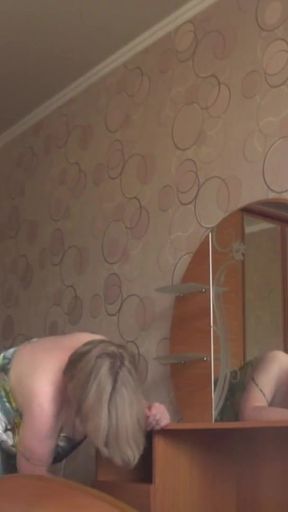 Memorable moment from &quot;A neighbor watches a mature housewife through an open window.&quot;