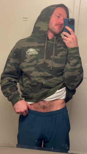 Man in camo hoodie taking selfie