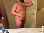 Just a fat guy showing off his body.