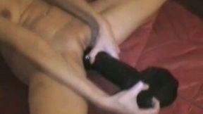 Filthy wife stretches her pussy to its limits with black monster dildo