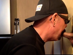 Inked mature DILF blowing gloryhole BBC