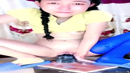 Petite Asian makes huge toy disappear