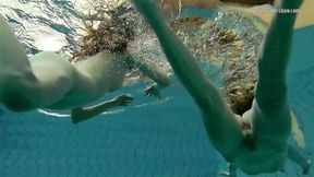 Nastya undresses Libuse in the pool like a lesbian