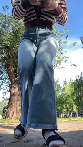 Woman in denim shorts and flip flops