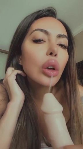 Lela Star sucks her own nipples and fucks her tight pussy with a huge dildo