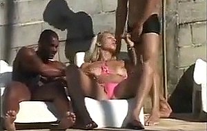 Interracial threesome fucking by a pool