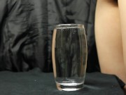 cumming in a glass of water