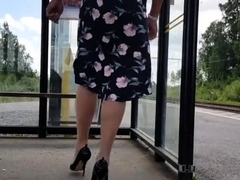 HannaTransa Chastity Crossdresser outdoors at train station.