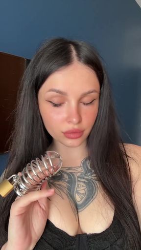 Domme mistress dominates submissive in chastity play