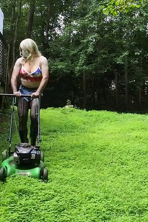 Big Fake Tits Crossdresser in Daisy Dukes Mowing Grass