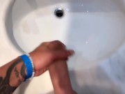Quick hotel bathroom cumshot into sink in swim trunks while friend is gone