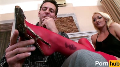 Kathia Nobili teases Nick Lang with her heels and red stockings in a sensual foot fetish scene