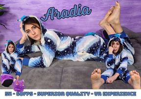 Stunning Aradia in a one-piece hooded pajama and purple slippers