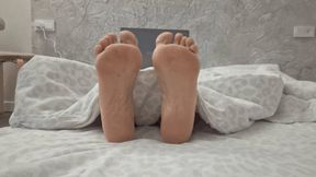 Soles from under the blanket F