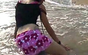 Stripping in the surf