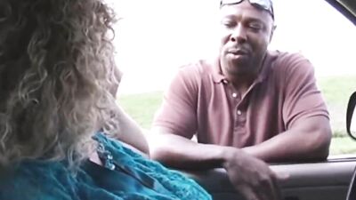 Curvaceous blonde MILF with curly hair rides a big black dick