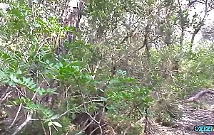A cute runner takes a break to suck a huge cock in the forest