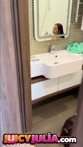 Juicy Julia  peeing in bathroom and showing her big tits