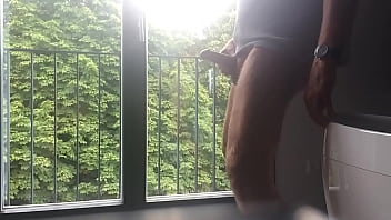 cumshot infront of a window