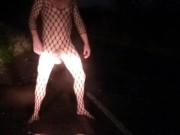 Fishnet bodysuit outside with passing car