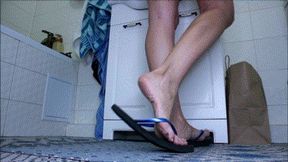 Black flip flops in bathroom AVI