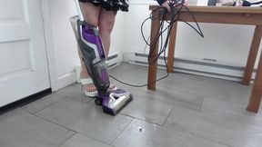 Muscular Calves While Vacuuming in White Stilettos with Gold Heel