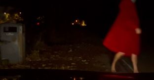 Interrupted while cutting off clothes , had to hide infront of car crouched down till car passed