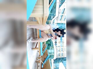 A angel in a public place out of pants flashes her snatch