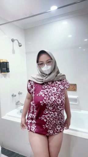 Fountain of a girl in a batik daster dress