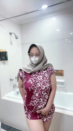 Fountain of a girl in a batik daster dress