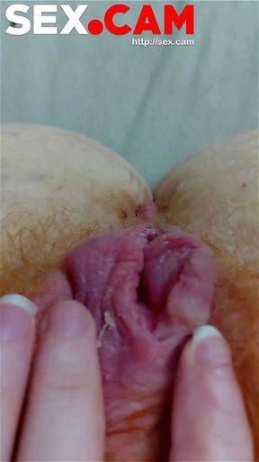 A redheaded girl is masturbating before she went to bed