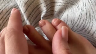 Toes with beige pedicure