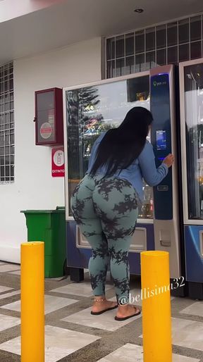 Woman in camo pants at an ATM