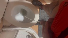 Hung, skinny tattooed pissing in the toilet