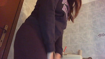 Nicoletta with her head completely inside the toilet
