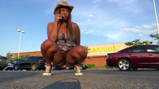 Peeing at crowded Best Buy parking lot.