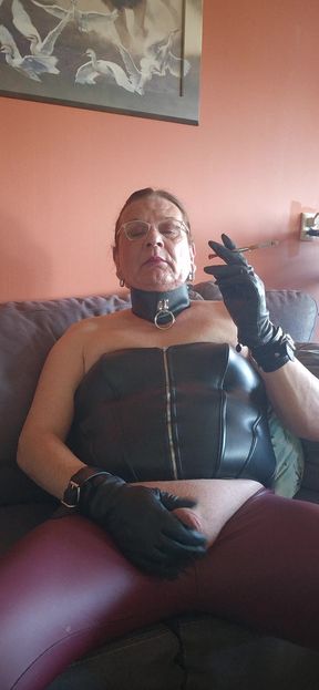 Smoking with a holder and leather gloves