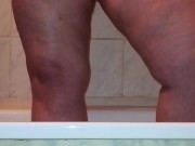 I caught a chubby mom playing with her fat pussy in the shower