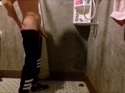 Russian guy shows his cock and pisses on the floor in the public toilet of the hostel